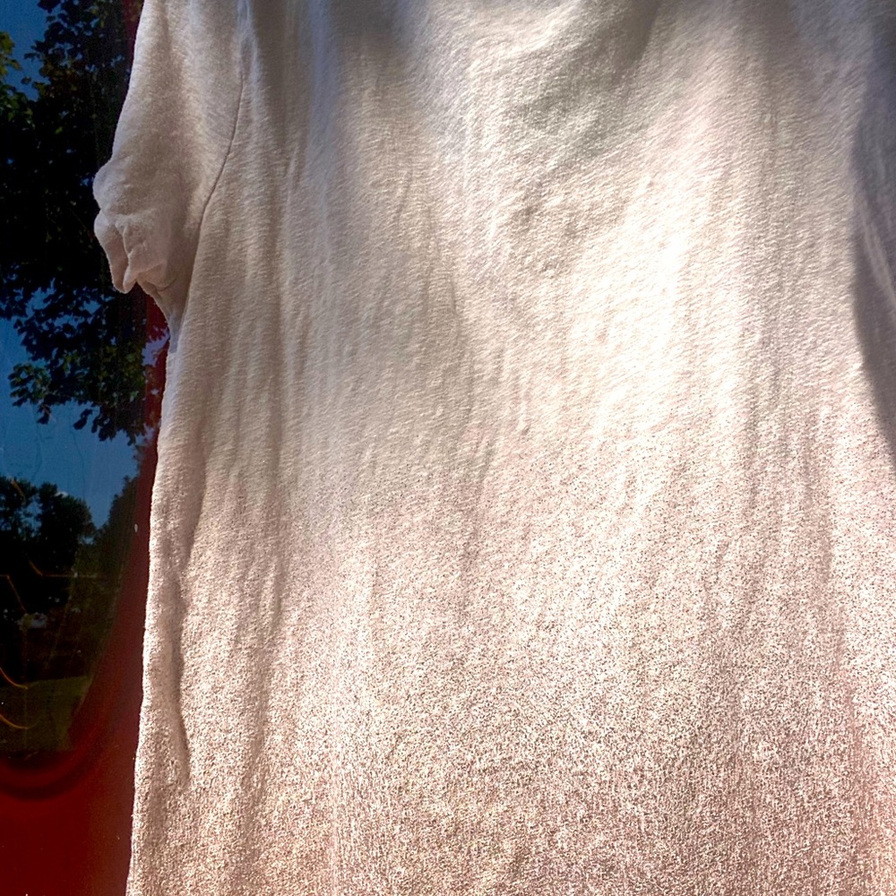 Off white with pinkish gold tones.  American Eagle Xl.